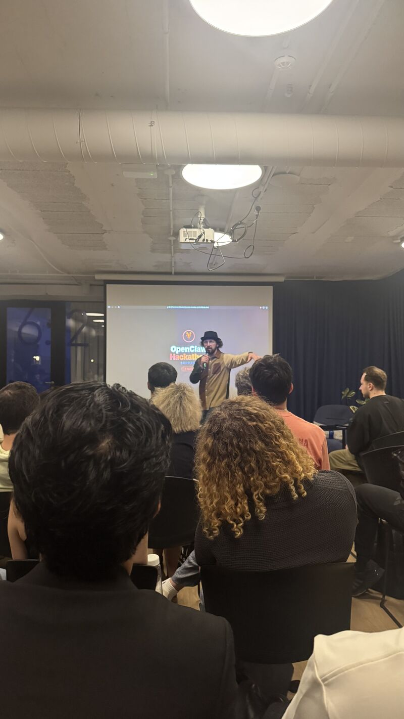An OpenClaw Hackathon talk photographed from the audience.